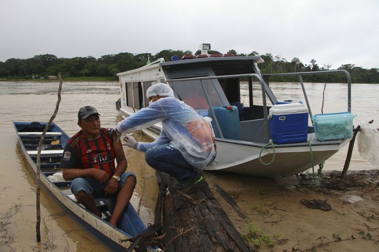 Boat, snowmobile, camel: Vaccine reaches world’s far corners
